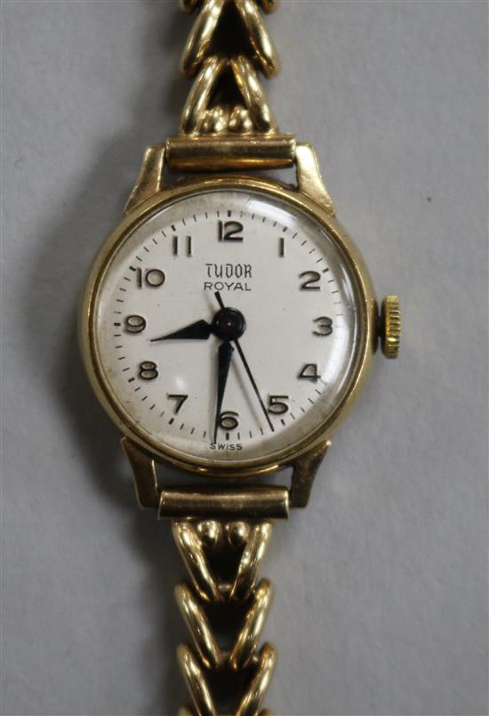 A ladys 1960s 9ct gold Tudor Royal manual wind wrist watch, on a 9ct gold bracelet.